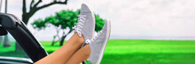 Summer Road Trip Car Fun Woman Sleeping With Feet Out The Window Of Convertible Sports Car On Travel Vacation Getaway Banner Panoramic Background. Girl Relaxing, Closeup Of Legs And Shoes.