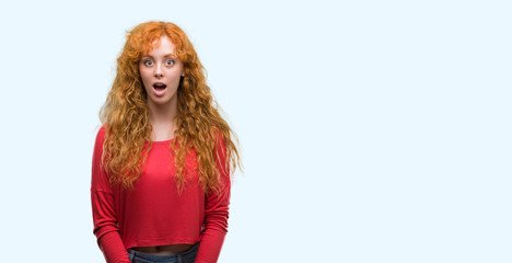 Sticker - Young redhead woman scared in shock with a surprise face, afraid and excited with fear expression