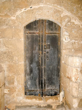 Old Hammered Double Door In Ancient Stone Masonry House In Old Jaffa. Tel Aviv, Israel.
