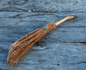 Wall Mural - witch broom on a wooden background