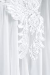 Wall Mural - Lace embroidery on a wedding dress closeup