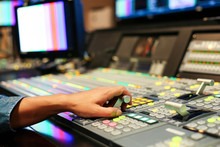 Hands On Dissolve Of Switcher Buttons In Studio TV Station, Audio And Video Production Switcher Of Television Broadcast.