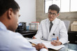 © Monkey Business - Young Asian male doctor in consultation with male patient