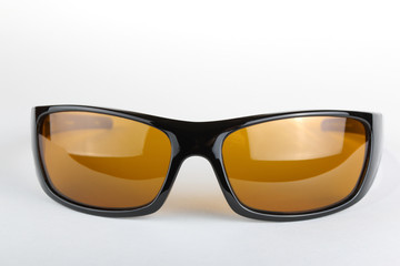 Sticker - Sunglasses with black plastic frame and yellow glass on a white background