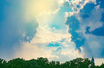 Clouds of the sun sky blue sunlight tree green background