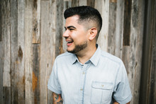 Portrait Of Happy Young Hispanic - Latino Man In City