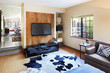 © Trinette Reed/Stocksy - TV / Media room in house in California