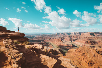 Wall Mural - Hiker on a cliff in Dead Horse Point State Park, Utah, USA