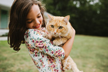 Little Girl Holding Cat