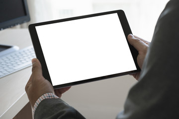 Poster - digital tablet computer close up man using tablet hands man multitasking with isolated screen