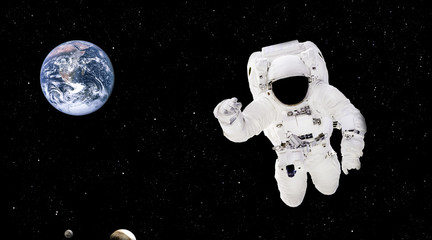 Poster - Spaceman close up in outer space. Astronaut in spacesuit close up isolated on black background. Planet Earth from outer space. Elements of this image furnished by NASA