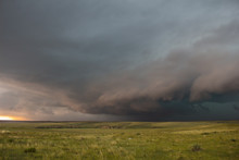 A Severe Thunderstorm Approaches Over The Great Plains Landscape. The Early Evening Sun Casts An Eerie Light.
