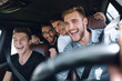 © ASDF - Group of happy friends on a car