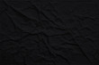 Dark wrinkled paper texture, abstract vector black background