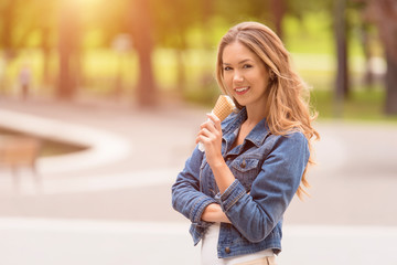 Wall Mural - Beauty girl eating ice cream