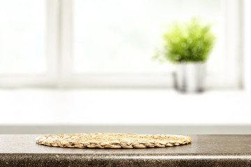 desk of free space and window background with small plant 