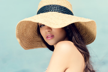 Wall Mural - attractive sensual girl posing in straw hat