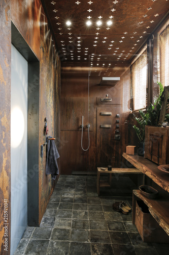 Modern Bathroom With Corten Steel Wall Cladding And Ceiling