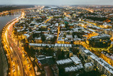 Fototapeta Miasto - Drone aerial view of Kaunas city at night