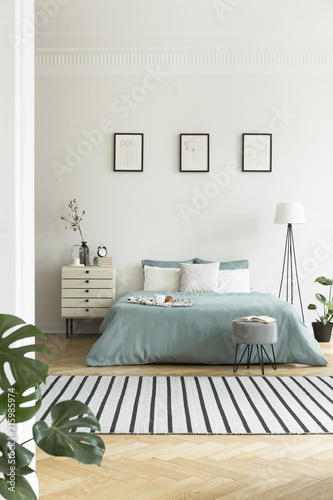 Real Photo Of Bright Bedroom Interior With Three Simple Posters Real Photo Of Bright Bedroom Interior With Three Simple Posters Striped Carpet And Pastel Green
