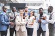 © xartproduction - Portrait of an handsome businesswoman in front of his team. recognition, movement on the career ladder, success in business