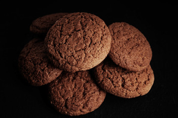 Wall Mural - oatmeal cookies on a black table