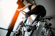 © Take Production - Fitness woman working out on exercise bike at the gym.exercising concept.fitness and healthy lifestyle