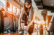 © Take Production - woman tying shoe laces.Female sport fitness getting ready for workout in gym.