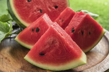 Wall Mural - Fresh sliced watermelon wooden background