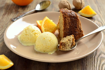 Wall Mural - Orange cake with walnuts and ice cream