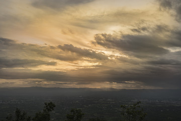 Wall Mural - Sunset in the mountains with forest and big shining sun