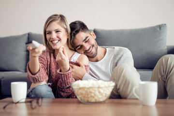 Wall Mural - Young couple watching tv