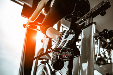 Fitness woman working out on exercise bike at the gym.exercising concept.fitness and healthy lifestyle