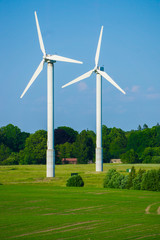Wall Mural - windmill type wind electricity generator in the field in latvia in summer