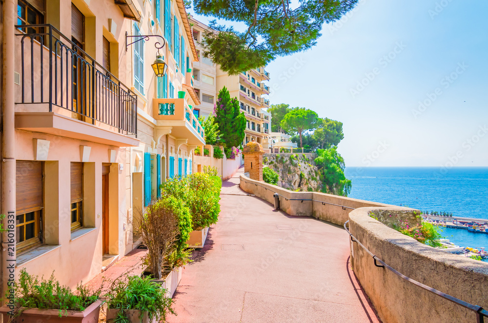 Monaco, Monte carlo. Monaco village with colorful architecture and street along the ocean. - obrazy, fototapety, plakaty 