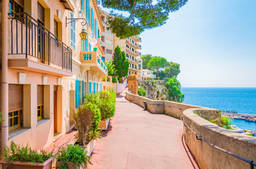 Fototapete - Monaco, Monte carlo. Monaco village with colorful architecture and street along the ocean.