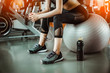 © Take Production - Portrait of Fitness woman  in gym listening to music.exercising concept.fitness and healthy lifestyle