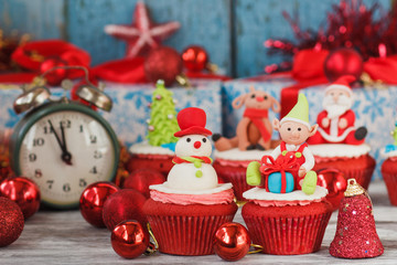 Wall Mural - Christmas cupcakes with colored decorations