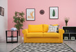 © New Africa - Modern living room interior with comfortable yellow sofa near color wall