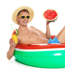 Sticker - Shirtless man with inflatable ring, watermelon and glass of cocktail on white background