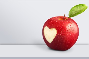 Wall Mural - Red apple with a heart shaped