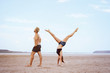 © indigo_nifght - He's with the girl doing some stretches in the desert. The girl stands upside down on her hands, and the guy turned away from her, creating an abstract combination of letters IY.