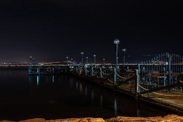 night shoot from a cute pier with chairs and tables