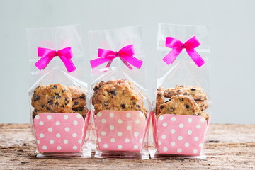 Wall Mural - Chocolate chip cookies in plastic bag packaging with ribbon bow.