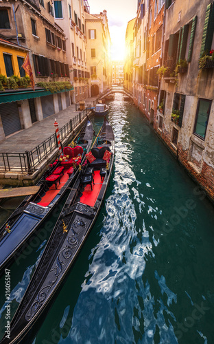 Canal with gondolas in Venice, Italy. Architecture and landmarks of Venice. Venice postcard with Venice gondolas. © daliu
