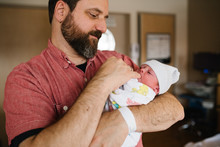Father Holding Newborn