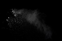 White Powder Explosion Isolated On Black Background