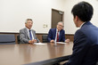 © tomoco_sozai - 就職面接を受ける若い男性
