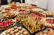 catering banquet table with tiny sandwiches