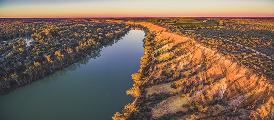 Wall Mural - Aerial panoramic landscape of Murray River in Riverland region of South Australia at sunset